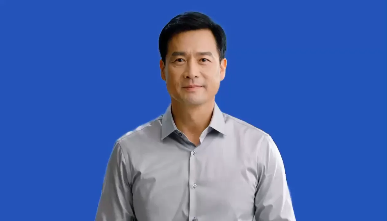 Presenter against a solid blue replacement